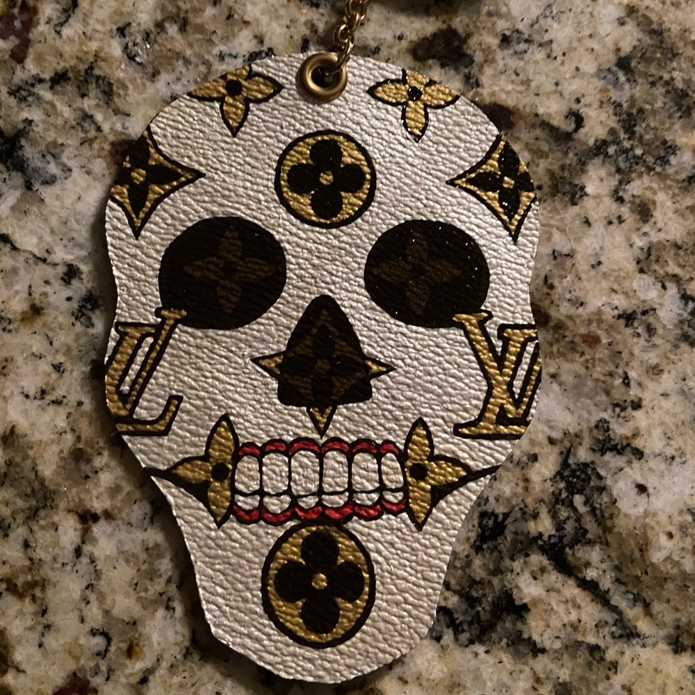 Hand paint Louis Vuitton sugar skull.
